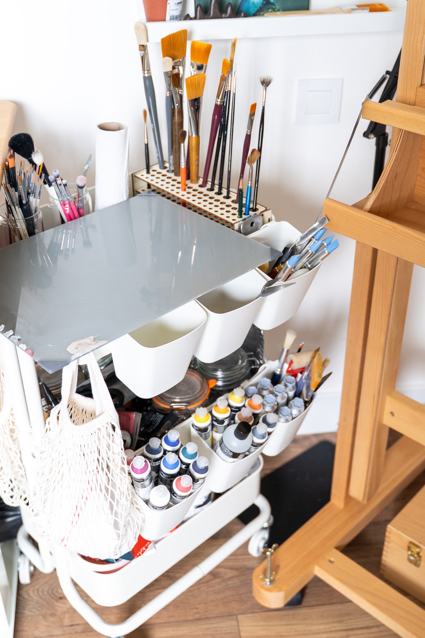 my painting cart with my oil and acrylic paints and my brushes